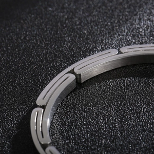 Minimalist silver stainless steel bracelet for men featuring geometric cutout and brushed finish