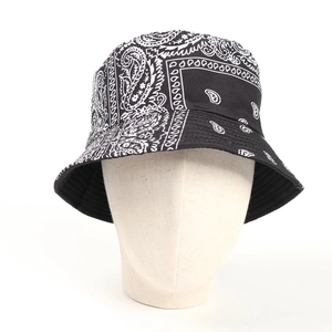 Front view of black and white paisley print bucket hat on a white mannequin head display