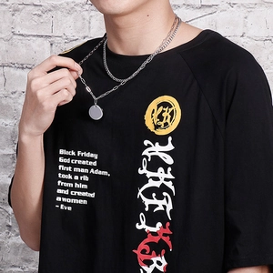 Double-layered stainless steel chain necklace with round pendant shown on a model