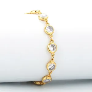 Chic gold plated chain bracelet with star and cubic zirconia pavé stones in white background