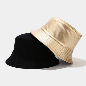 Retro double-sided bucket hat in black cotton and metallic gold leather for men and women