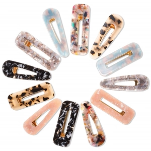 Set of 12 geometric acetate hair clips in assorted marble and tortoise shell patterns