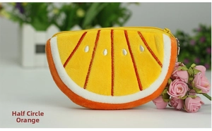 Detail of half-round orange plush coin purse with realistic fruit slice embroidery