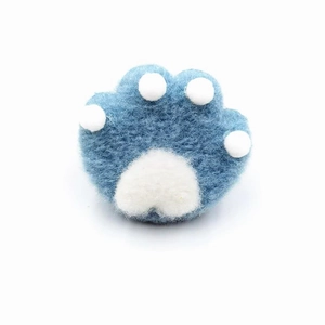 Cute blue and white plush wool felt cat paw brooch with soft handmade fiber texture