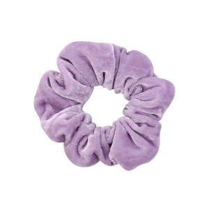 Elegant purple velvet scrunchie for hair styling on a clean white background