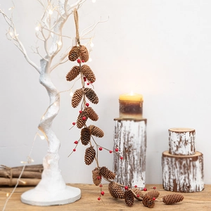 Christmas pine cone and red berry hanging ornament for festive indoor wall decoration