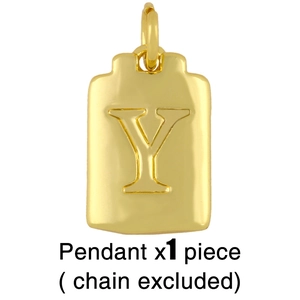 Detail shot of a golden rectangular Y-letter pendant with an embossed relief design
