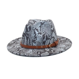 Detail of grey-blue snakeskin fedora hat with brown leather buckle strap and wide brim