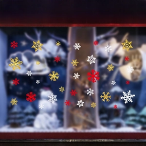 Detail of snowflake stickers in red and gold with sizes from 3.5cm to 13cm for windows