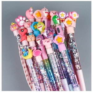 Close-up of assorted colorful cartoon pens with liquid glitter and silicone toppers