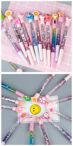 Close-up of glitter pens featuring colorful liquid sand and cute cartoon characters