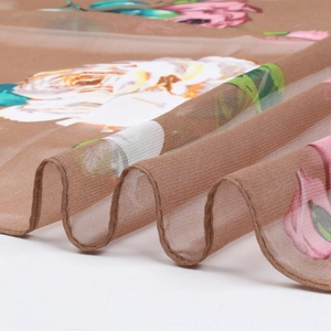 Elegant summer lotus georgette silk scarf with large floral patterns on brown fabric