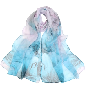 Lightweight gradient blue and pink chiffon scarf featuring a lotus floral print
