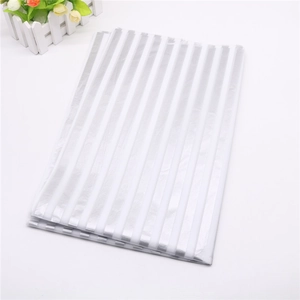 Detail of silver and white striped gift wrap paper with high-quality metallic finish
