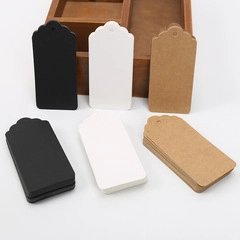 Blank heart-shaped kraft tags in black, white, and brown with decorative scalloped edges