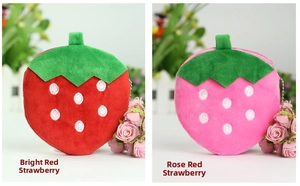 Detail of red and rose pink plush strawberry coin purses with green leaf accents
