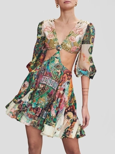 Detailed view of bohemian floral print dress with waist cut-outs and sequin embroidery