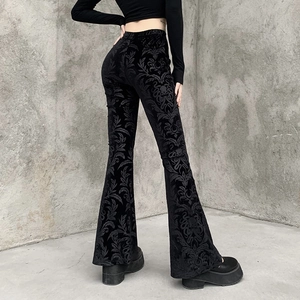 Detail of black velvet flare trousers with damascus floral embossing and back view design