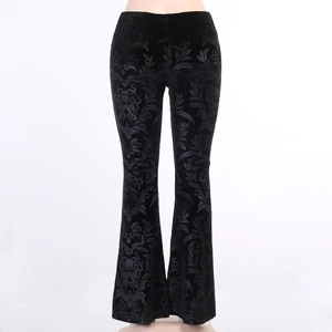 Detail showing the vintage vine embossed velvet texture on these black flare trousers