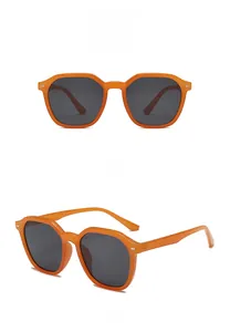 Detailed views of orange retro hexagon sunglasses with gray lenses from front and side