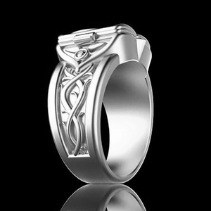 Detailed view of vintage silver ring with Celtic knot textures and embossed relief