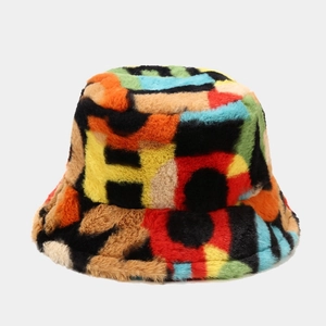 Detailed close-up showing the soft plush texture and vibrant graffiti print of the bucket hat