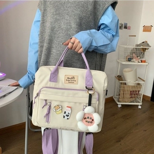 Japanese style cream canvas crossbody bag with purple straps and cute floral charms