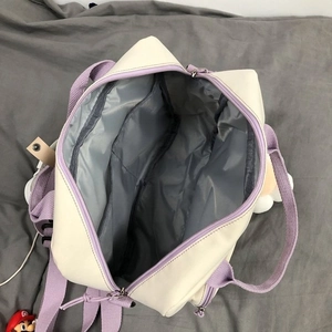Top view of cream canvas bag showing spacious interior with grey lining and compartments