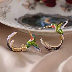 Exquisite hummingbird enamel earrings with green and orange accents in gold finish