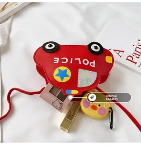 Interior view showing capacity of kids red police car crossbody bag for small items