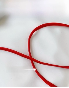 Close-up of vibrant red PU leather shoulder strap with meticulous stitching and edge oil