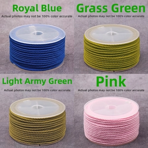 Macro detail of 2mm nylon cord spools in royal blue, grass green, army green and pink