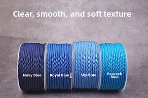 Macro shot of 2mm braided nylon cord spools in four shades of blue for DIY jewelry