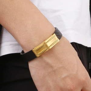 Men's black woven leather and gold stainless steel bracelet with geometric design