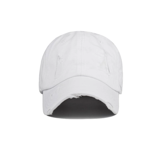 Distressed white washed cotton baseball cap with ripped details and a vintage worn look