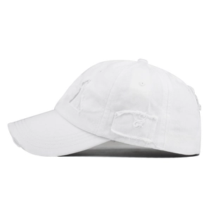 Distressed white cotton baseball cap with vintage frayed holes and six-panel design