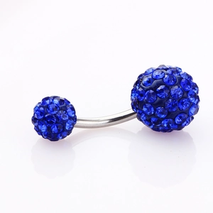 Macro shot of silver navel ring with double faceted blue crystal Shamballa balls