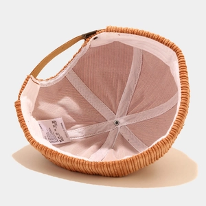 Inside view of brown corduroy docker cap showing six-panel stitching and sweatband