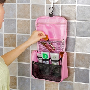 Pink hanging toiletry bag with waterproof nylon and multiple mesh organizer pockets