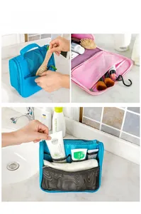 Detail of hanging toiletry bag with mesh pockets and hooks in blue and pink versions