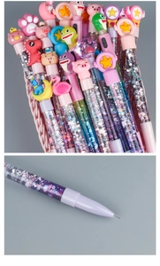 Close-up of cute cartoon glitter pens showing liquid quicksand and fine ballpoint tips