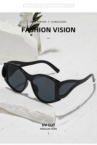 Detail of black punk sunglasses with teardrop hollow temples and UV protection lens
