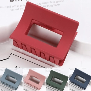 Detail of matte rectangular hair claws in various colors for thick hair styling