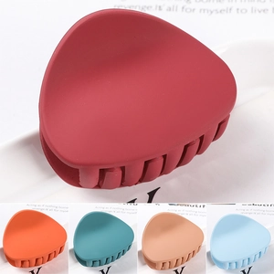 Matte finish large hollow claw clips in red, orange, teal, tan and light blue colors