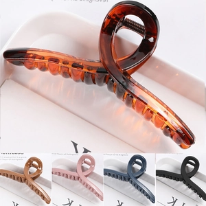 Detail view of large resin hair claw clip in tortoiseshell and multiple color options