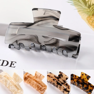 Detailed top view of large grey marble geometric hair claw clip with multiple color options