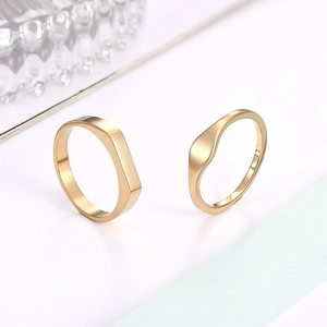 Irregular 14K gold titanium steel rings with geometric facets and polished finish
