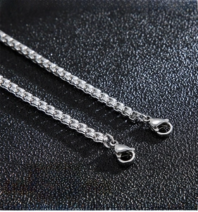 Macro shot of silver box chain with lobster clasp highlighting durable rustproof texture