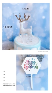 Detailed view of white reindeer cake topper and Merry Christmas card with dimensions
