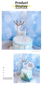 Detail of white glitter reindeer cake topper with gold antlers for Christmas decoration